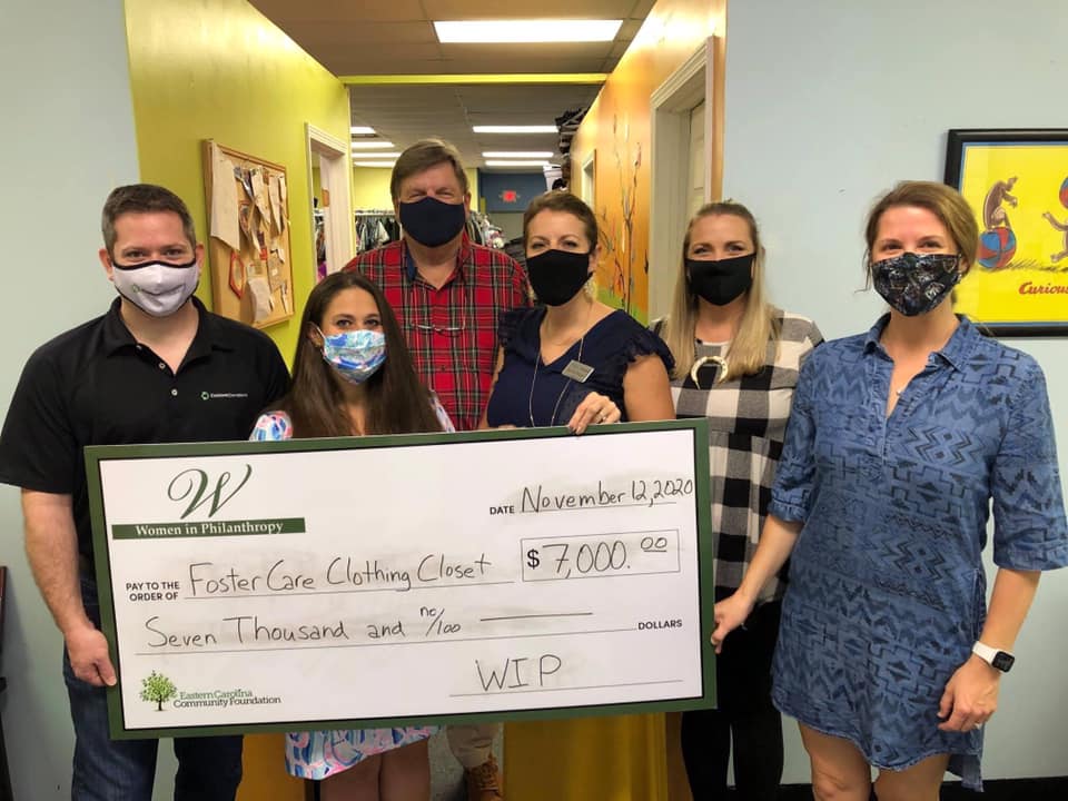 Women in Philanthropy presented the Foster Care Clothing Closet with a Check